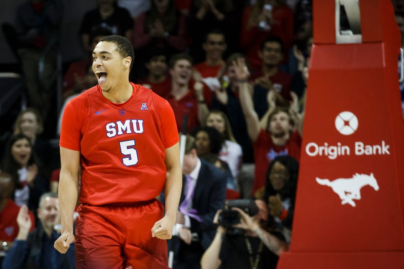 SMU forward Ethan Chargois (5) celebrates after making a basket during the first half of an...