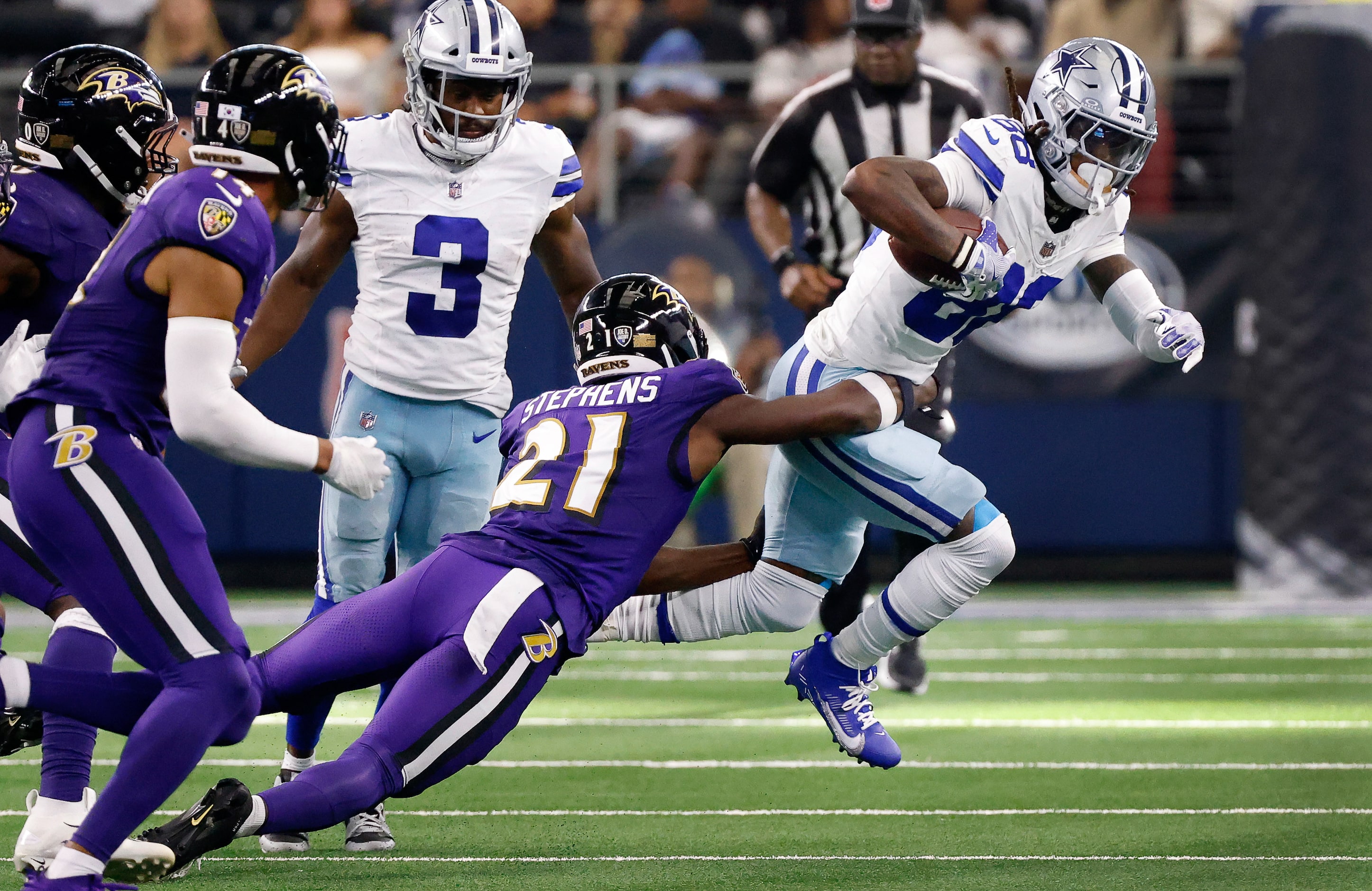 Dallas Cowboys wide receiver CeeDee Lamb (88) is tackled by Baltimore Ravens cornerback...