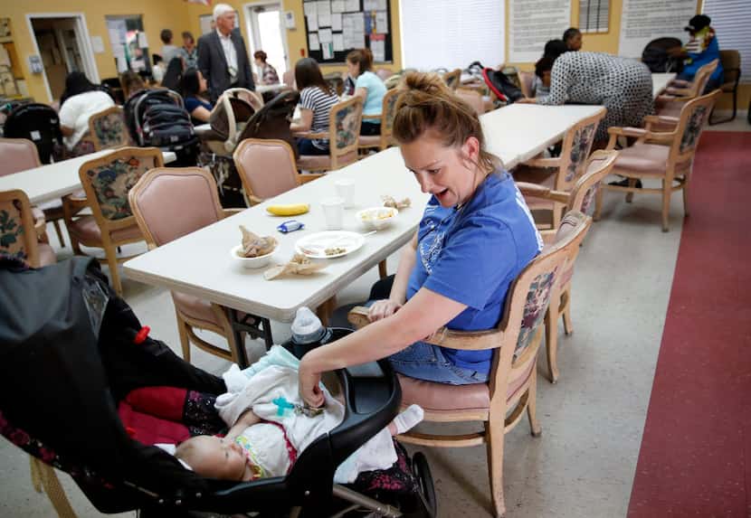 Bonnie Butler plays with her daughter Klarity as the BAMBI group eats lunch at Santa Maria...