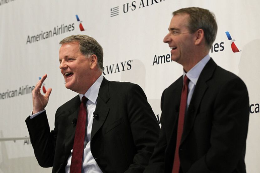 American Airlines CEO Tom Horton (right) shared the spotlight with US Airways CEO Doug...