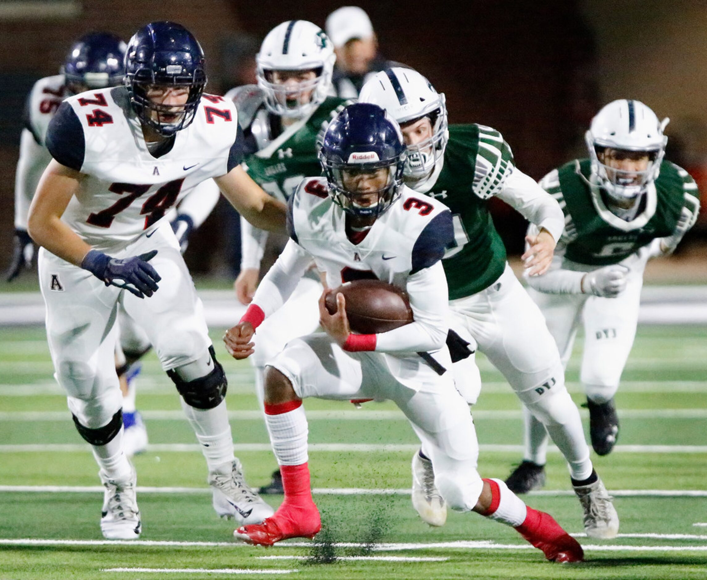 Allen High School quarterback Raylen Sharpe (3) carries the ball during the first half as...