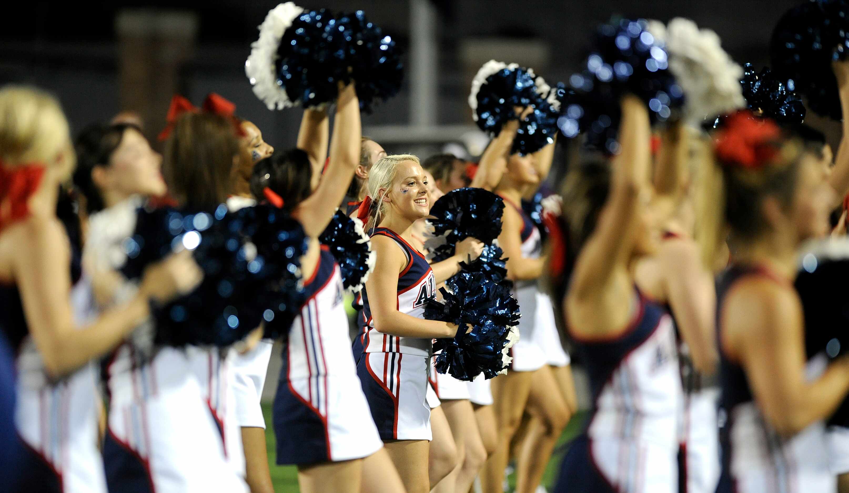 Allen's McKenzie Anderson, junior, cheers with her squad in the second quarter during a high...