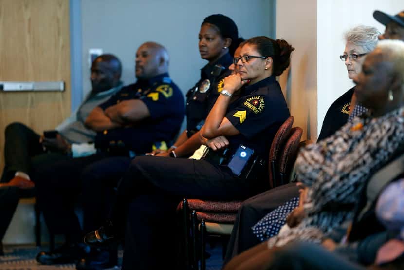 Dallas officers listened last month at a news conference as Hall announced the new command...