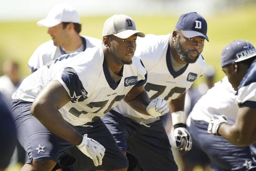 Dallas Cowboys offensive linemen Robert Brewster (79), left, and Leonard Davis (70) protect...