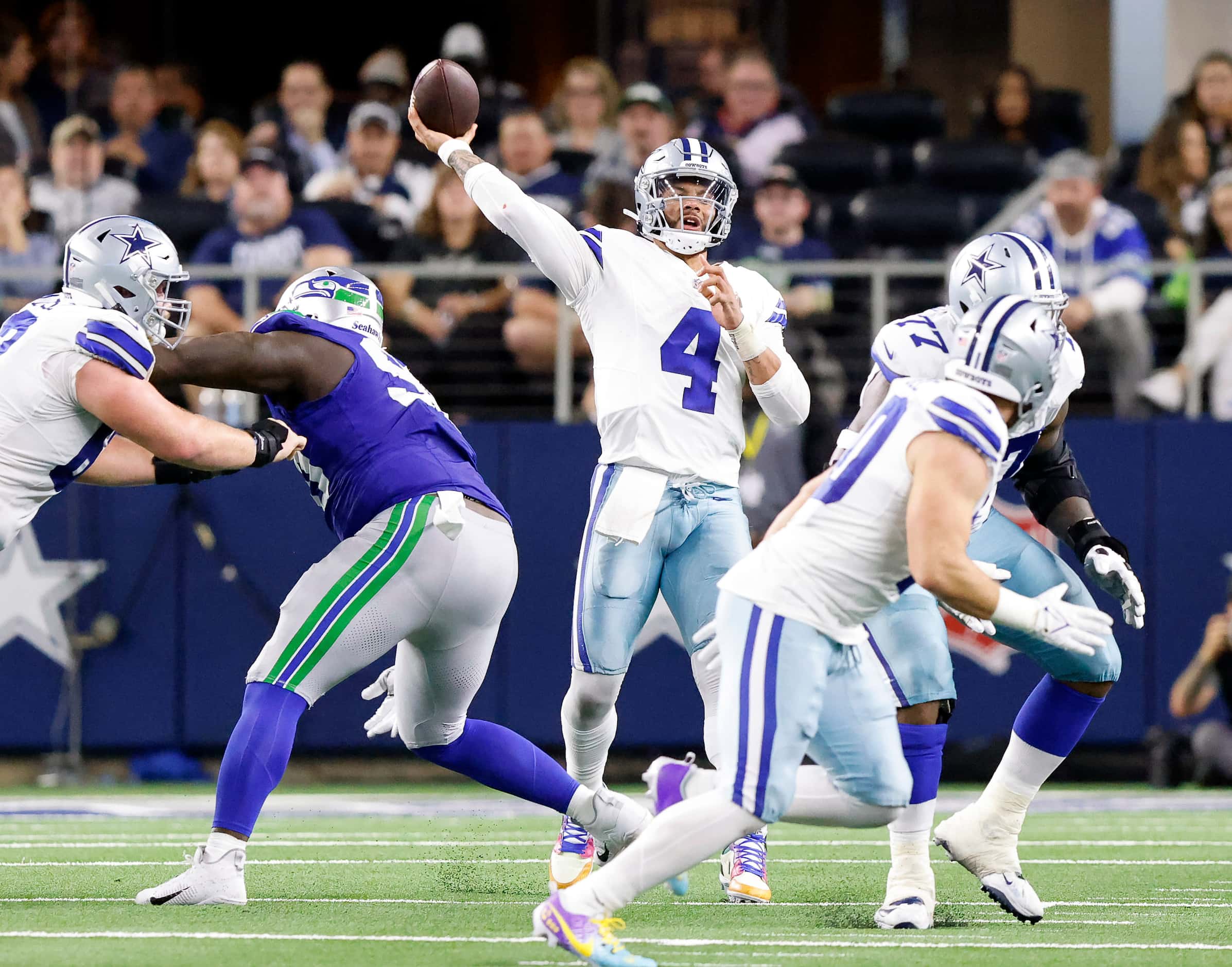Dallas Cowboys quarterback Dak Prescott (4) heaves a long fourth quarter pass to wide...