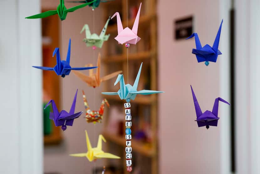 Origami cranes hang from the ceiling at The Art Room, a nonprofit art studio, Monday, Jan....