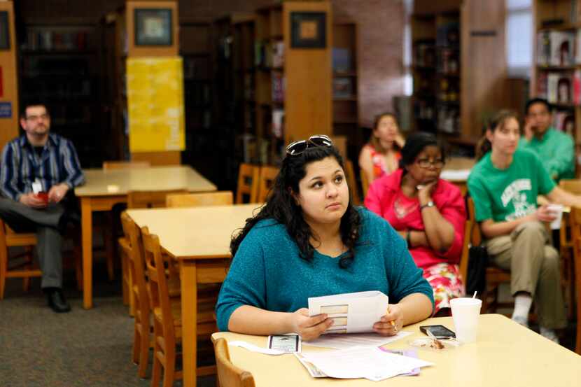 Parent Ana Cedillo listens to a DISD official during a workshop with DISD for the State of...