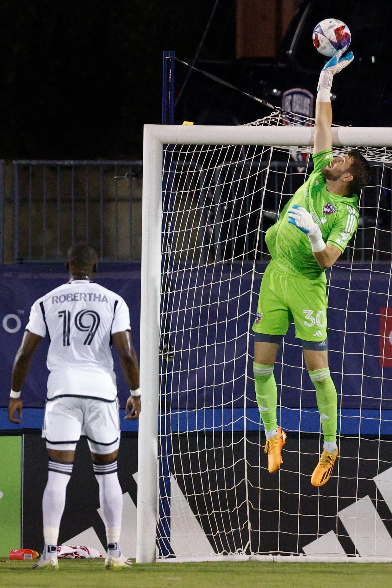 FC Dallas goalkeeper Maarten Paes (30) tips a shot attempt over the goal during the second...