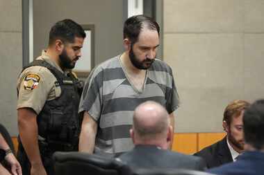 Daniel Perry enters the courtroom May 10, 2023, in Austin, where the former U.S. Army...