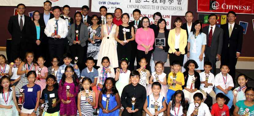 Winners gathered with their trophies after the annual youth speech contest put on by the...