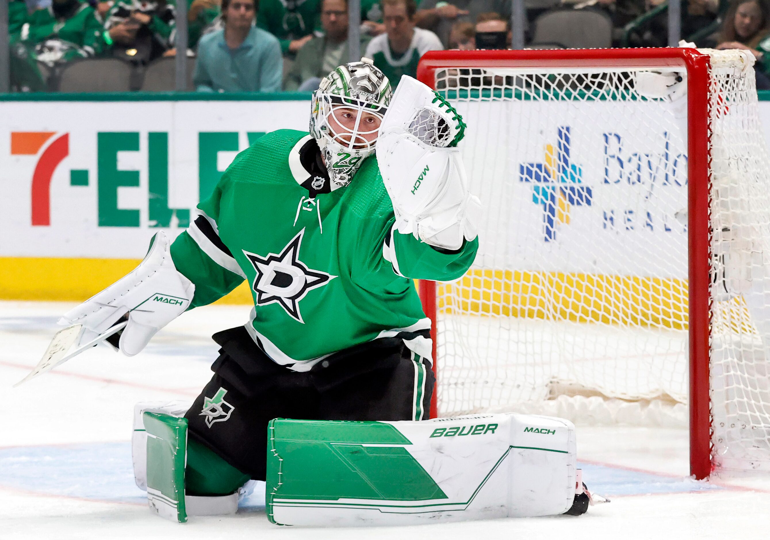 Dallas Stars goaltender Jake Oettinger (29) gloves a Seattle Kraken shot during the second...