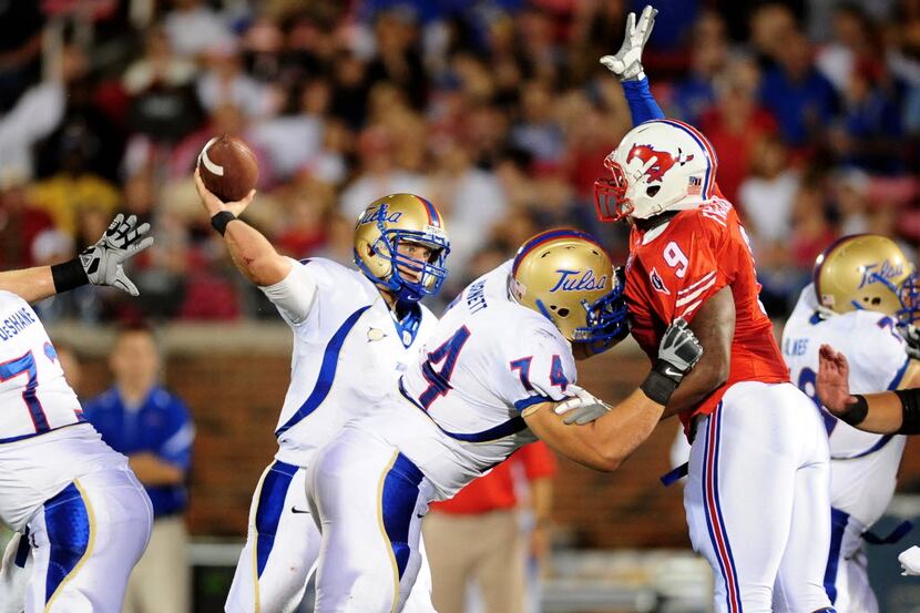 FILE - Tulsa quarterback G.J. Kinne throws a pass that would be tipped by SMU defensive...