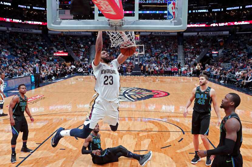New Orleans Pelicans forward Anthony Davis dunks on the Mavericks Tuesday night in the...