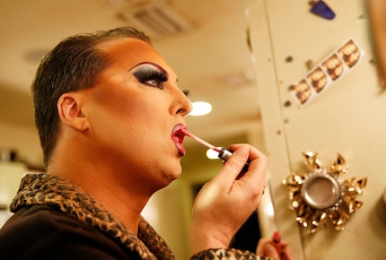 James Love applies his makeup before performing as "Cassie Nova" at Sue Ellen's in Dallas in...