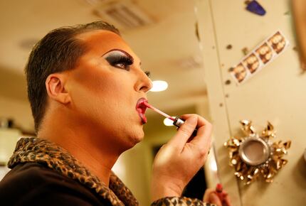 James Love applies his makeup before performing as "Cassie Nova" at Sue Ellen's in Dallas in...