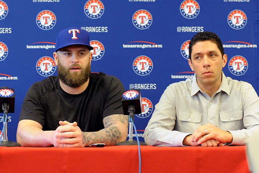 Texas Rangers manager Jeff Banister (28), first baseman Mike Napoli (5) and President of...