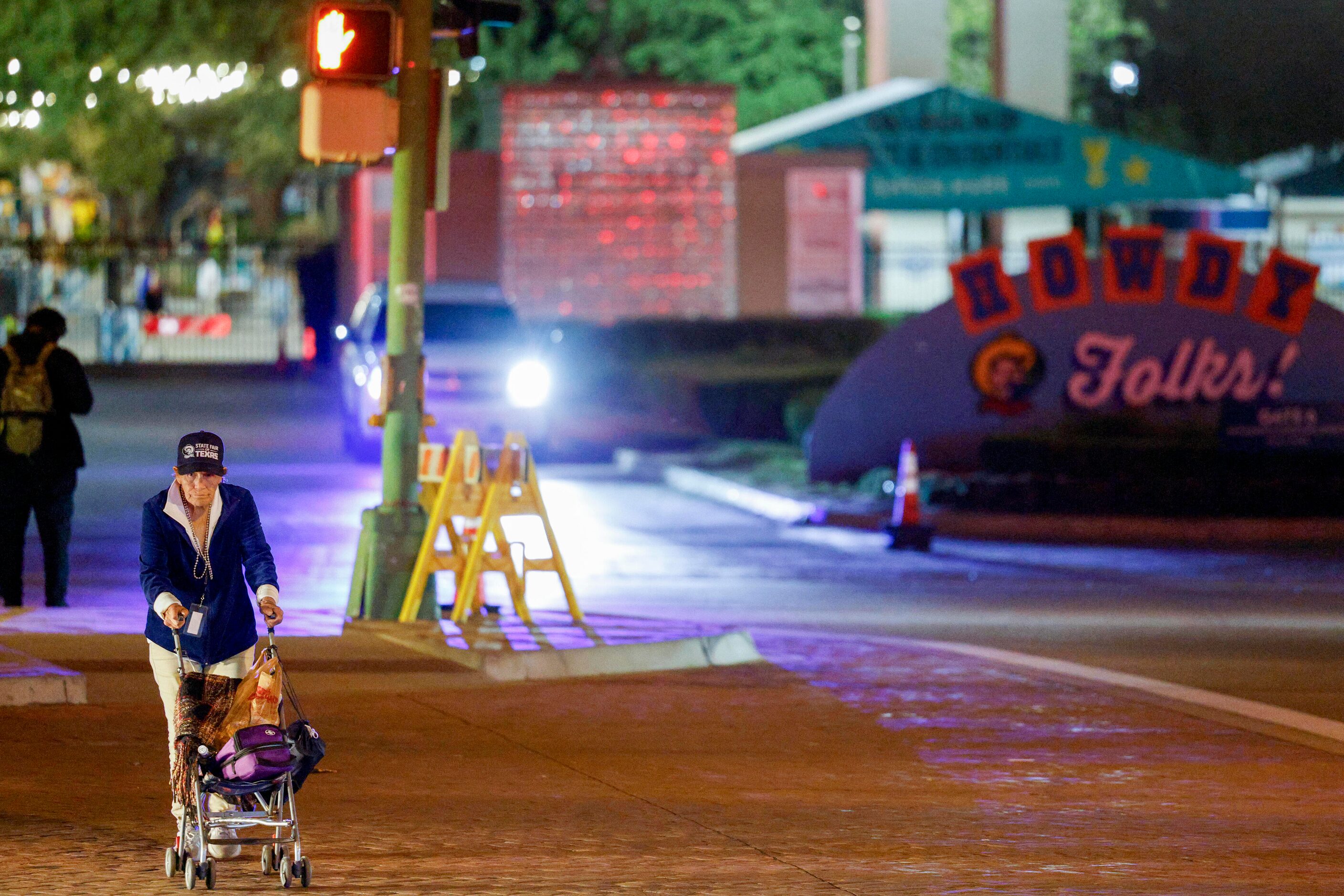 A State Fair of Texas employee crosses Robert B. Cullum Boulevard after a shooting occurred...