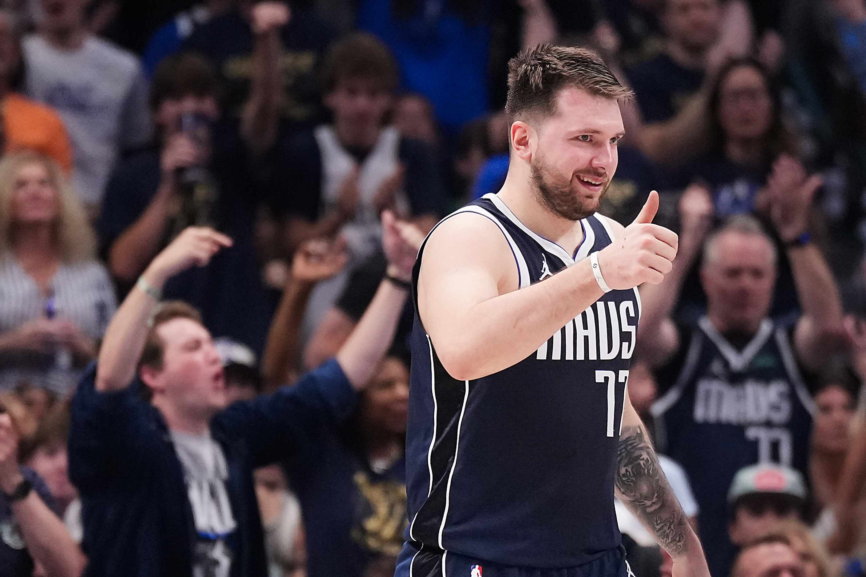 Dallas Mavericks guard Luka Doncic celebrates after a basket during the first half in Game 4...
