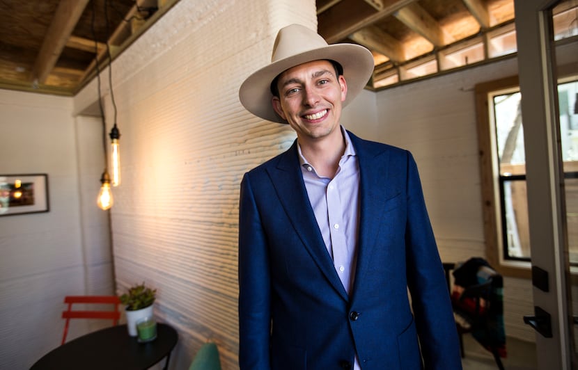 Jason Ballard, one of the co-founders of ICON, stands inside a 3-D printed house that was on...