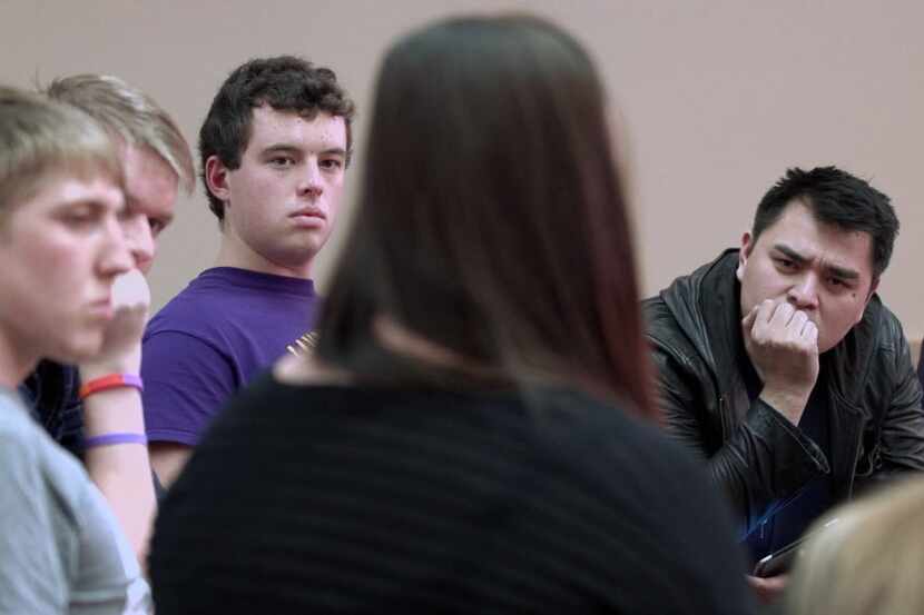 Filmmaker Jose Antonio Vargas, right, listens to a group of young people during the filming...