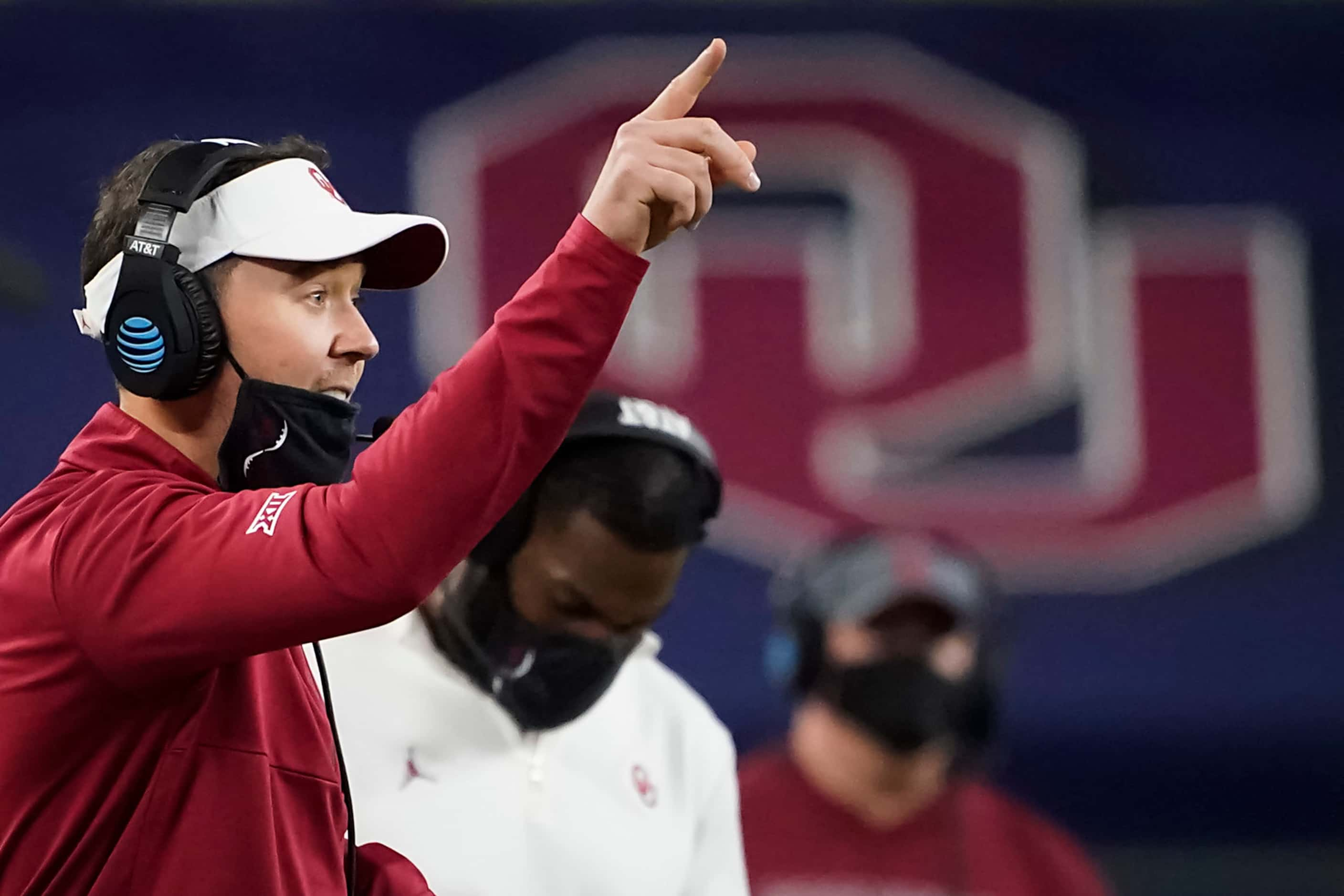 Oklahoma head coach Lincoln Riley calls in a play during the second half of the Cotton Bowl...