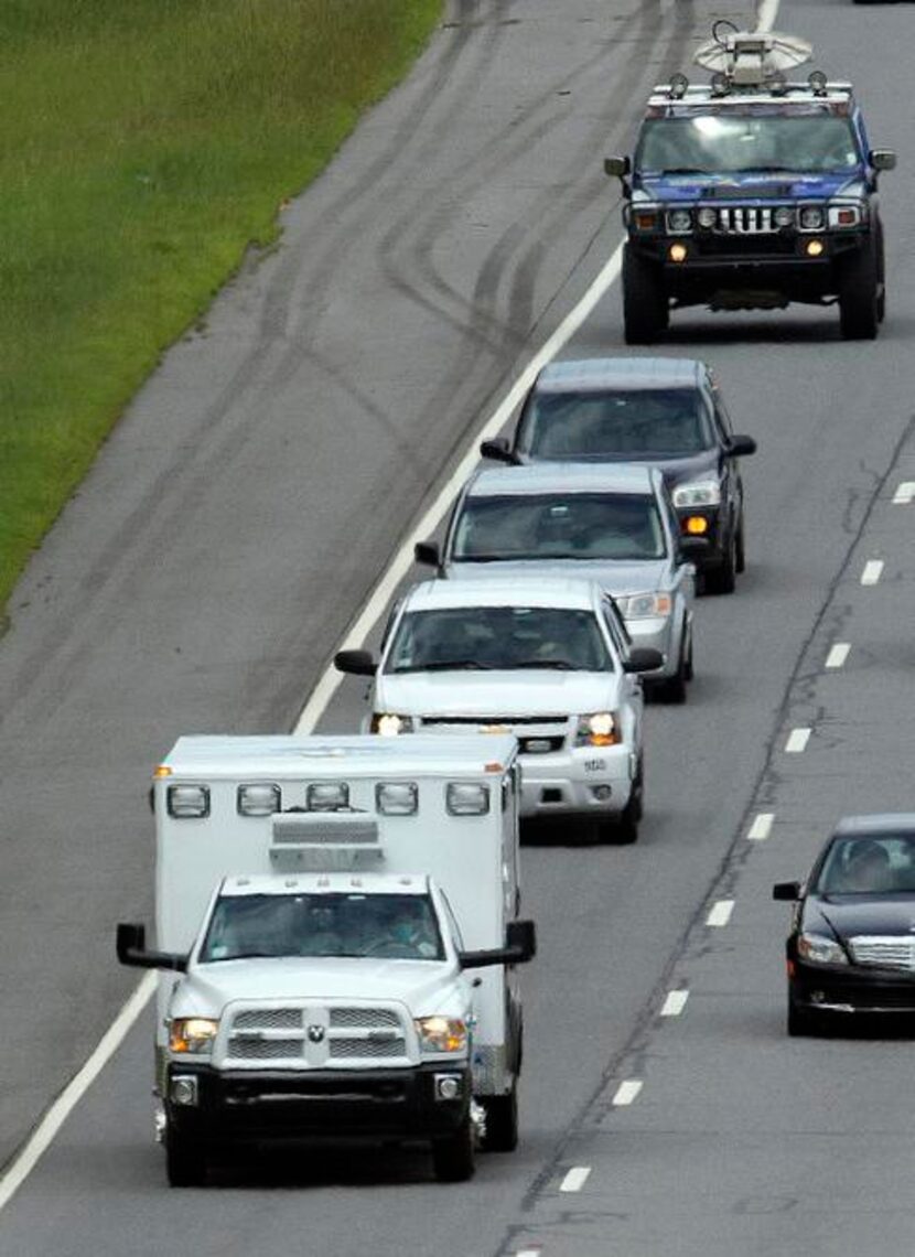 
An ambulance left Dobbins Air Reserve Base  near Interstate 75 on Saturday in Marietta, Ga....