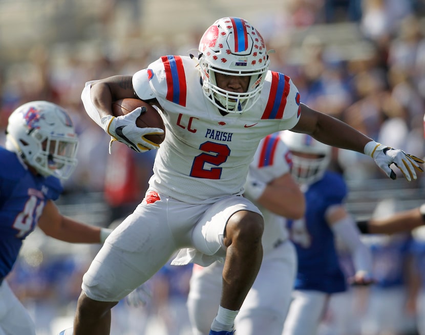 Parish Episcopal running back Andrew Paul (2) leaps over a defender enroute to a first...