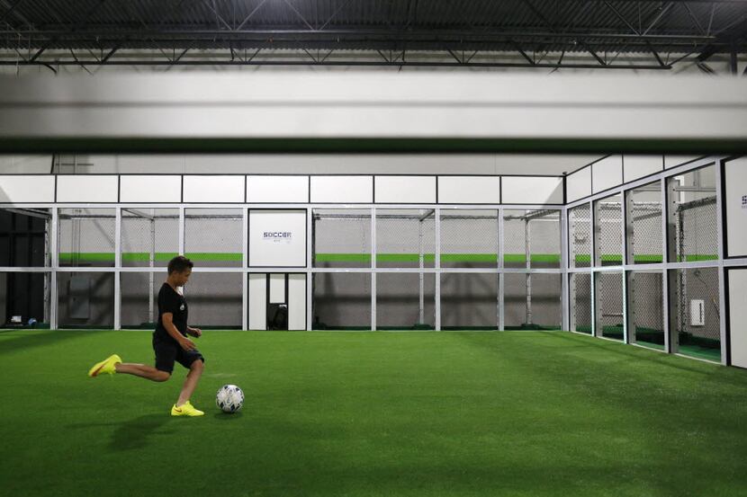  Parker Meese, 9, of Frisco practices in the Robotic Training Center at Performance Indoor...