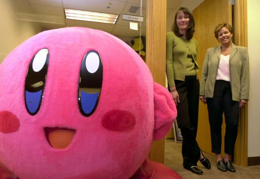 Gail Tilden, Nintendo vice president of brand management, and Melinda Porter, right, a...