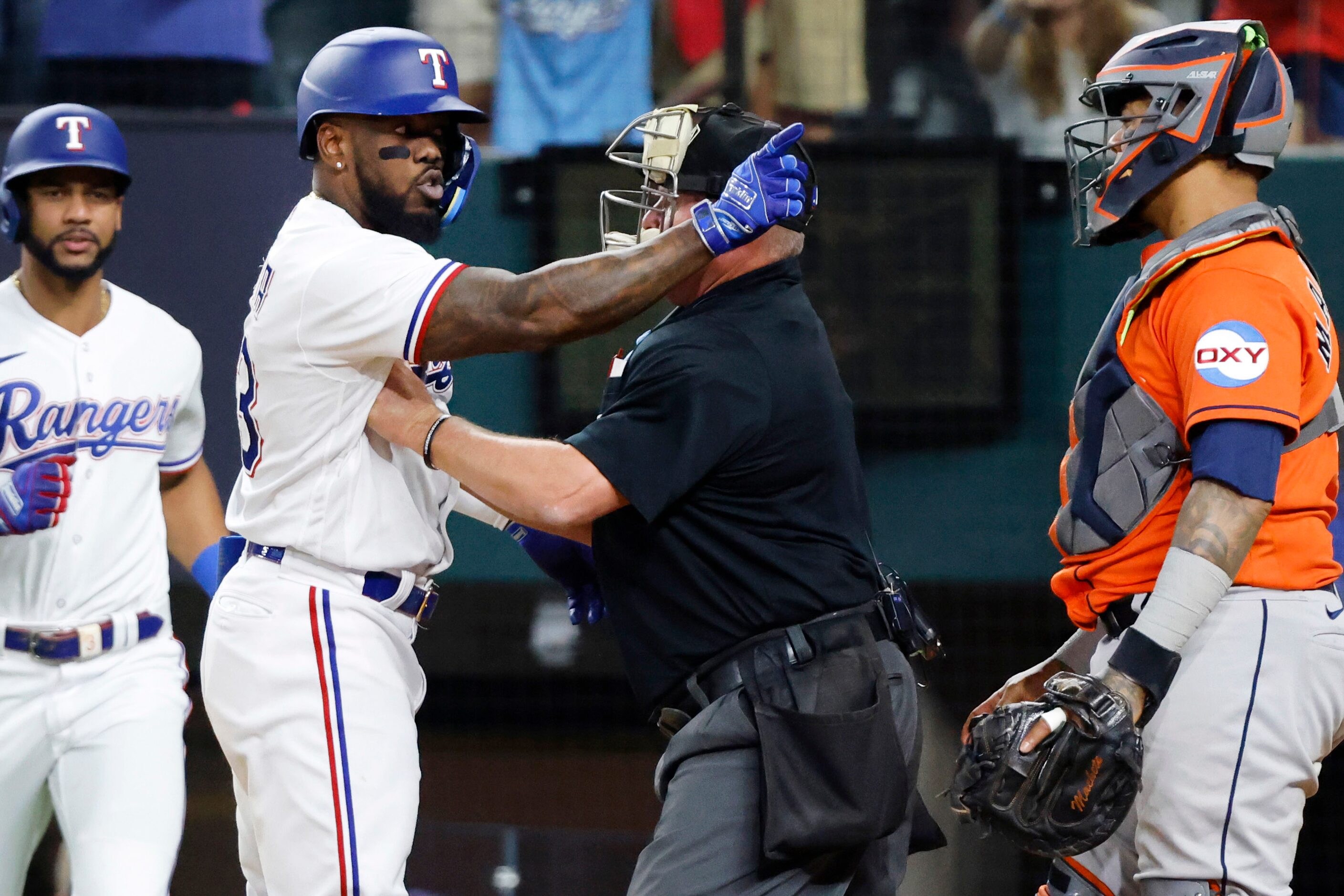 Texas Rangers right fielder Adolis Garcia (53) argues with Houston Astros catcher Martin...