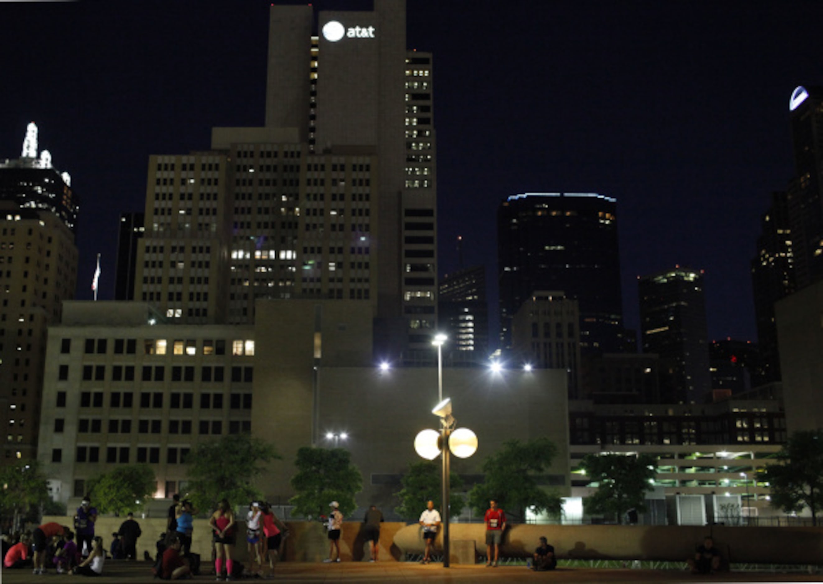 Participants of the Dallas Rock 'N' Roll half marathon stretch before the race begins on...