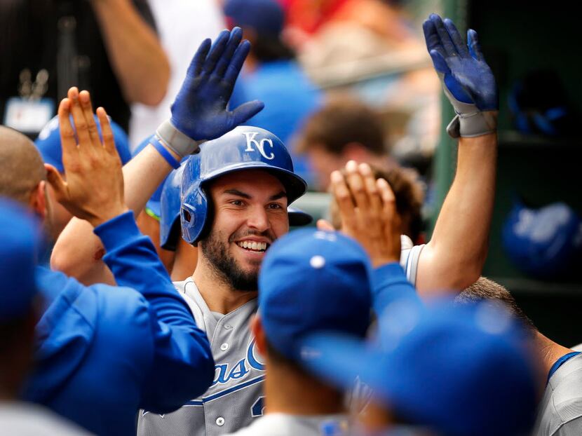 Kansas City Royals first baseman Eric Hosmer (35) is congratulated by teammates in the...