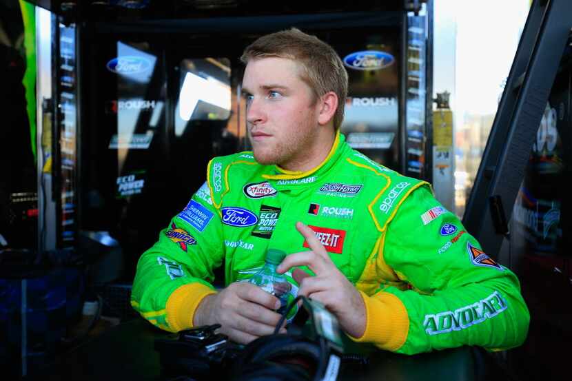 AVONDALE, AZ - NOVEMBER 13:  Chris Buescher, driver of the #60 AdvoCare Ford, stands in the...