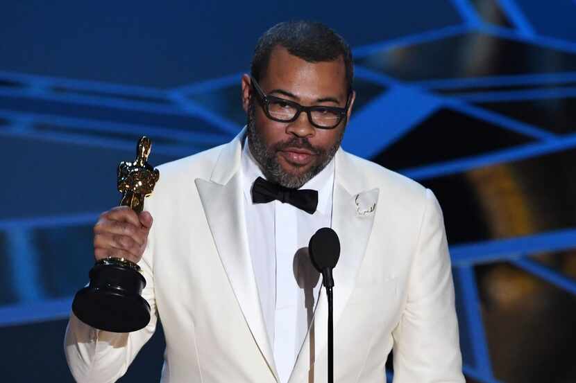 Director Jordan Peele delivers a speech after he won the Oscar for Best Original Screenplay...