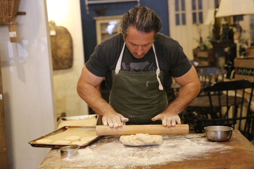 Chef Robert Lyford prepares cheddar biscuits at Patina Green Home and Market in McKinney.