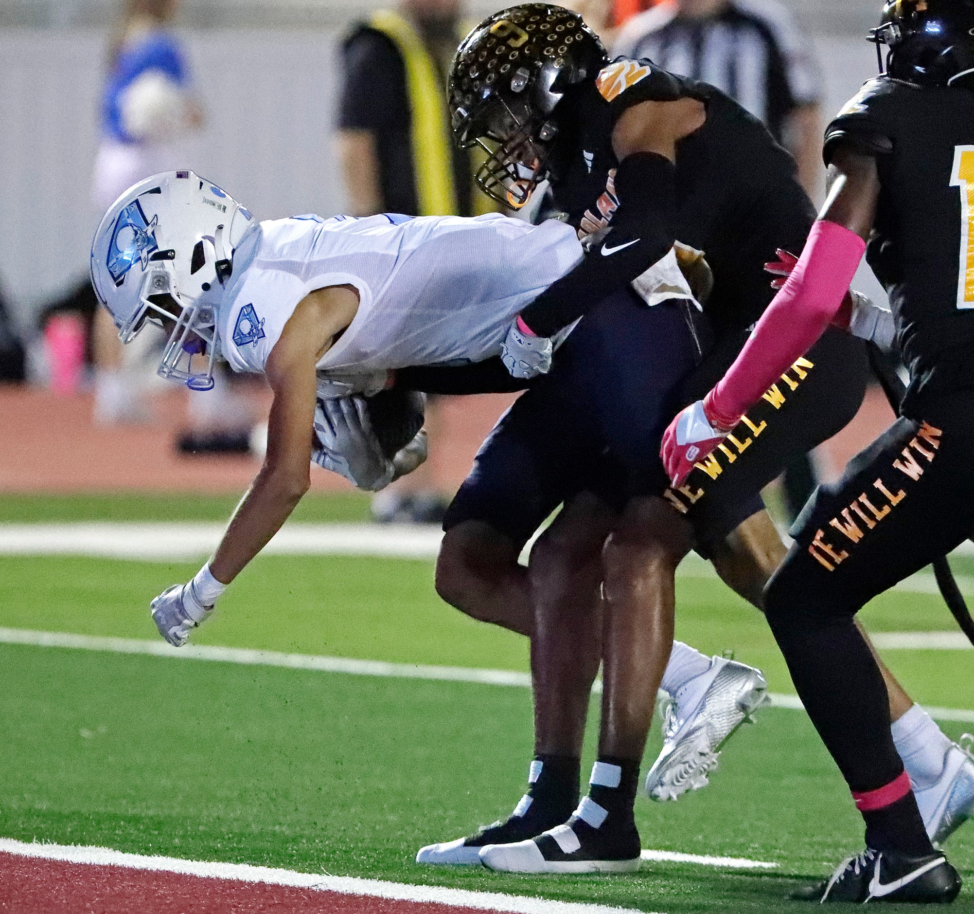 Garland High School cornerback Colton Dunbarger (9) prevents Wylie East High School wide...