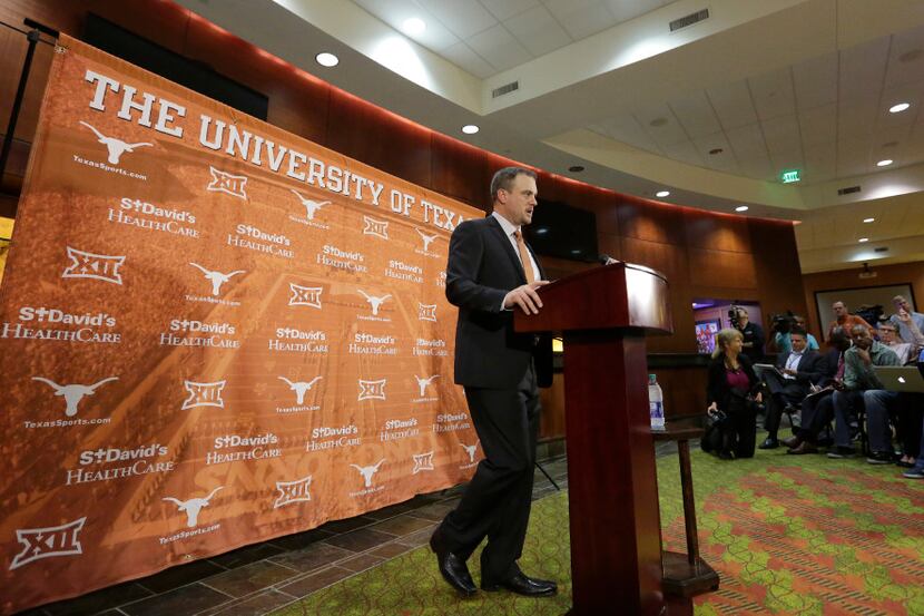 Tom Herman talks to the media during a news conference where he was introduced as Texas' new...