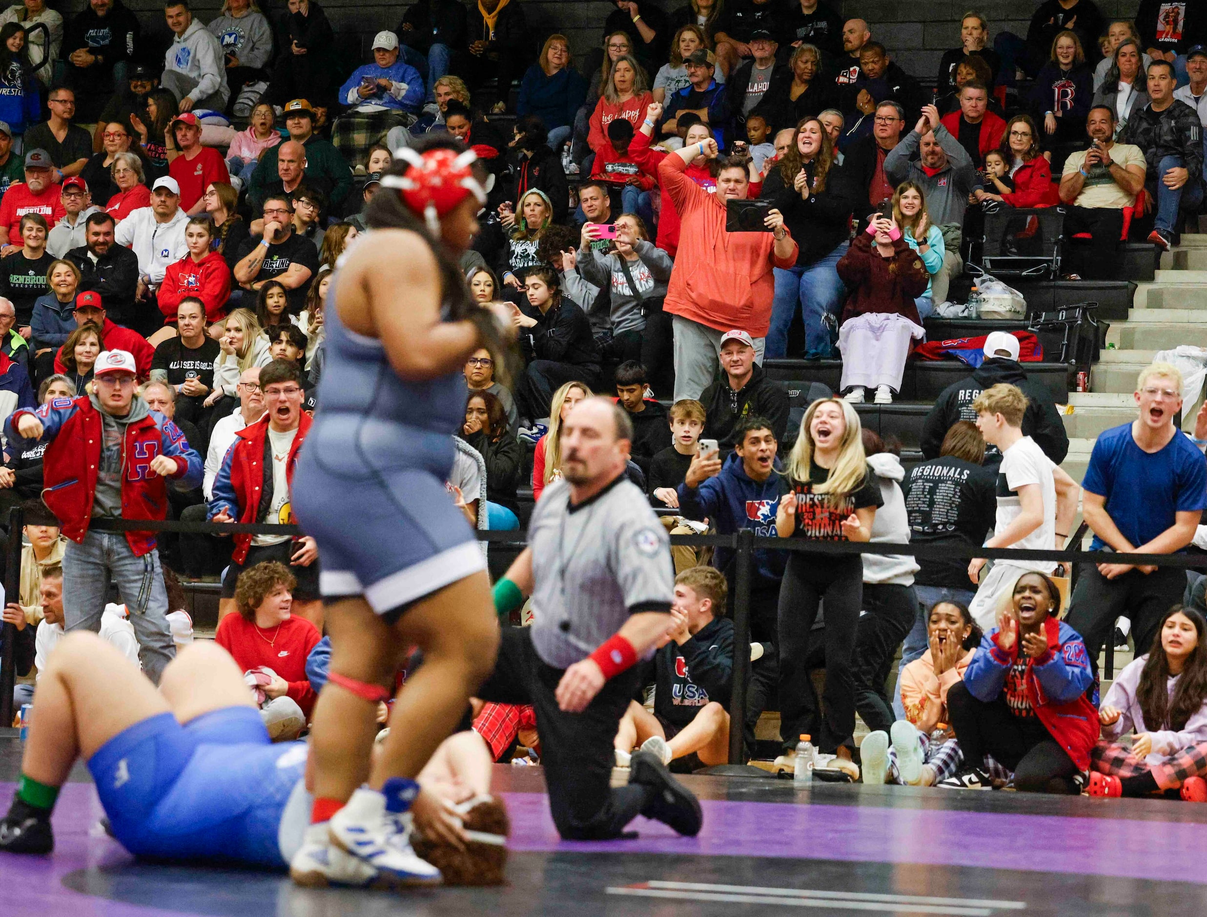 Crowd cheer Kendall Jones’ win over Gabriela Garzona of Frisco during 5A Region II wrestling...