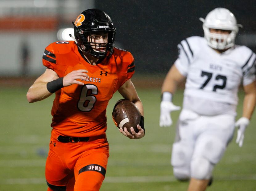 Rockwall RB Zach Henry (6) picks up long yardage during the first half of a high school...