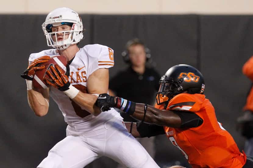 Texas wide receiver Jaxon Shipley (8) catches a touchdown pass in front of Oklahoma State...