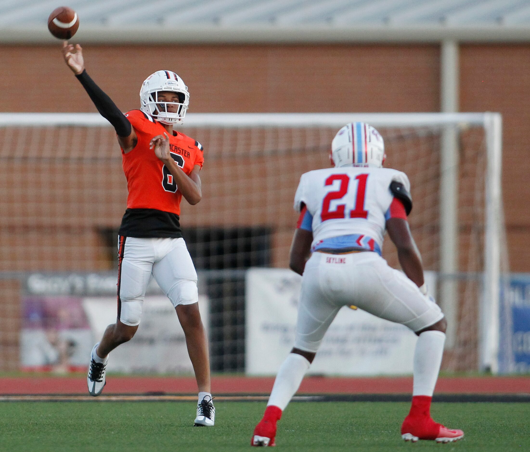 Lancaster quarterback Carter Jones (6) launches a pass downfield as Dallas Skyline...