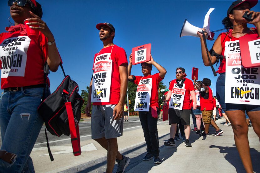 Protestors marched outside the new corporate headquarters for American Airlines in Fort...