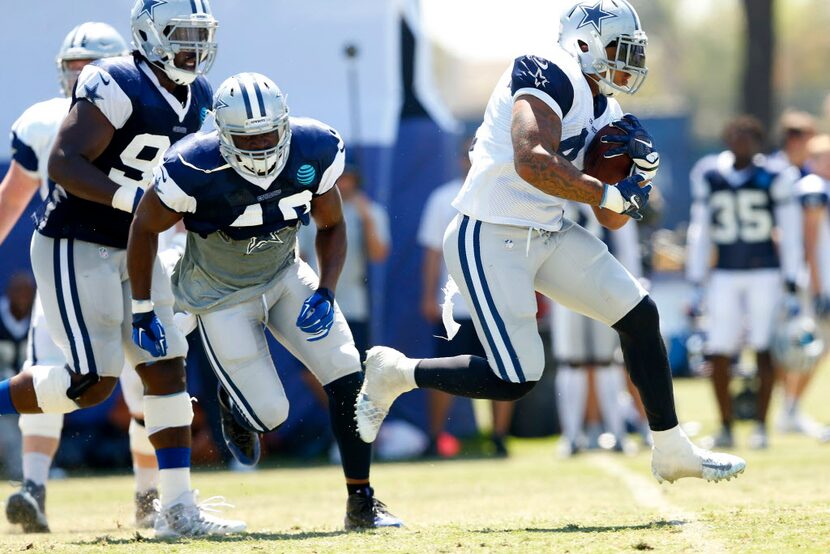 Dallas Cowboys fullback Keith Smith (41) carries the ball against the defense during final...