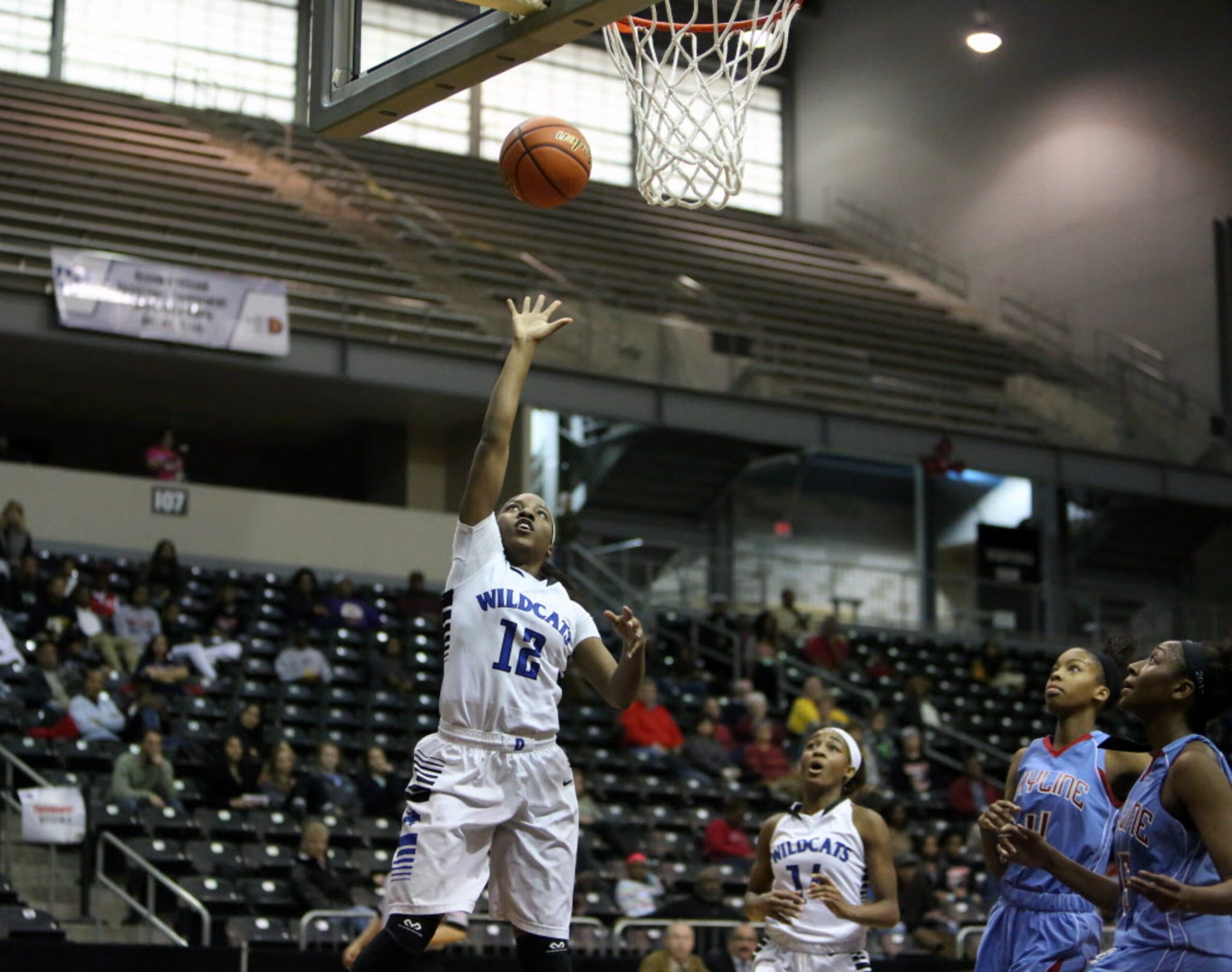 Dekaney's Kene Hamilton drives to the hoop during the 4th quarter of the region II AAAAAA...