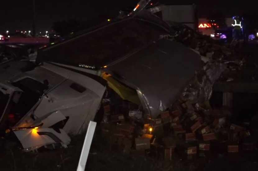 An 18-wheeler spilled hundreds of boxes of chicken after it overturned Tuesday on Interstate...