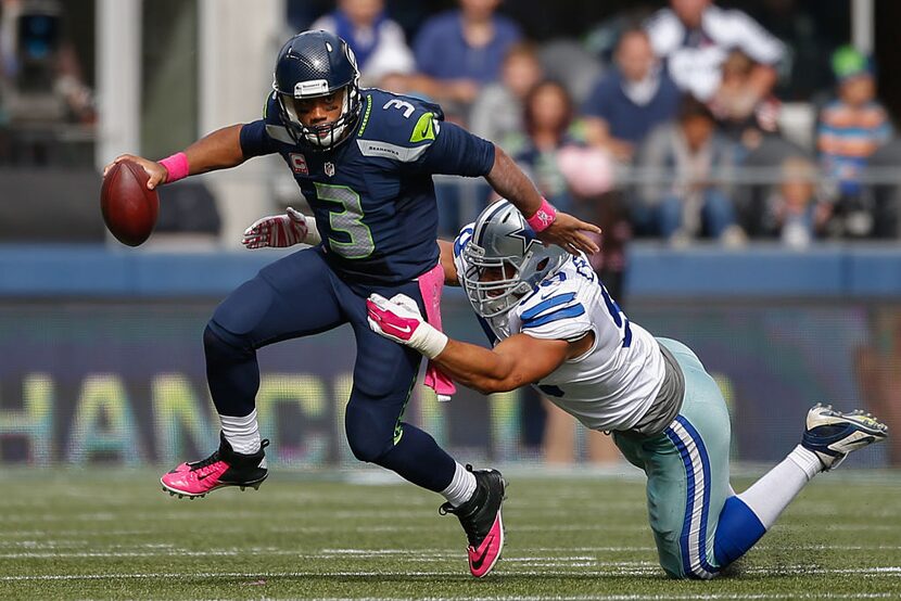 SEATTLE, WA - OCTOBER 12:  Quarterback Russell Wilson #3 of the Seattle Seahawks rushes...