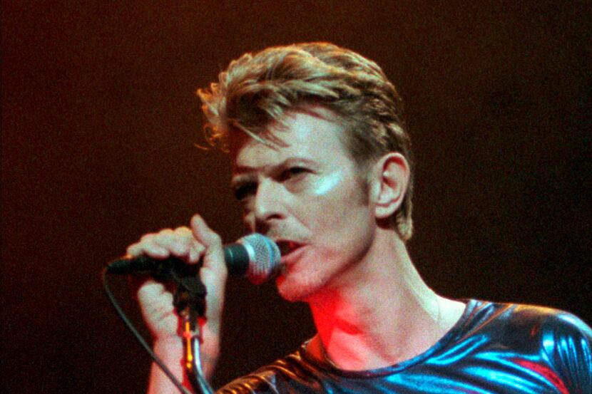 In this Sept. 14, 1995, file photo, David Bowie performs during a concert in Hartford, Conn.