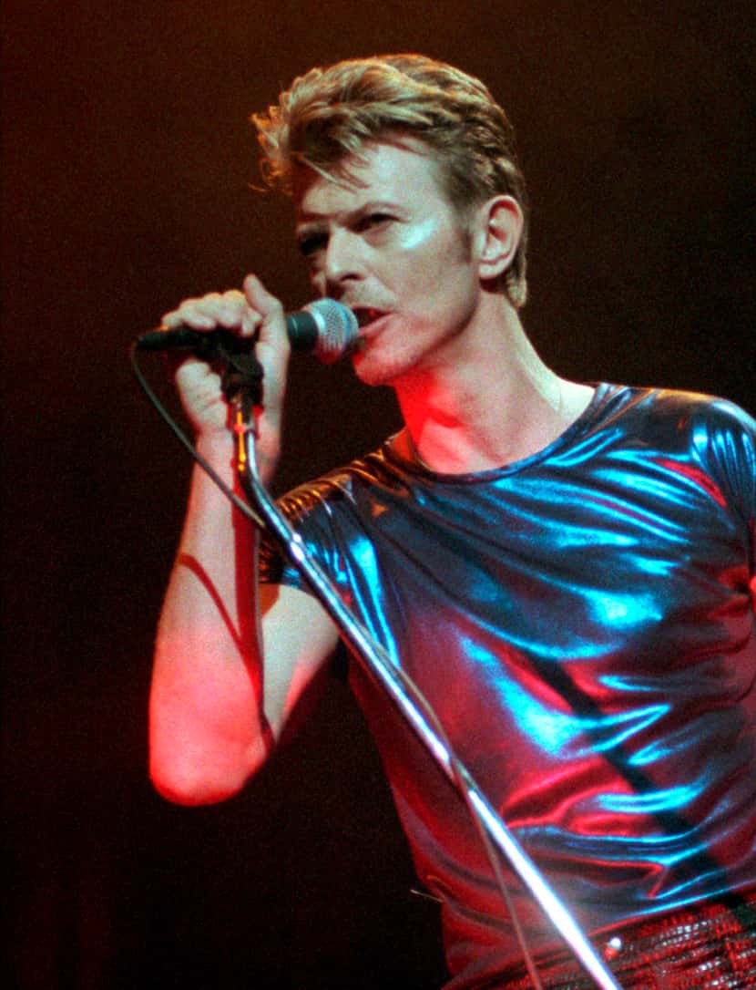 In this Sept. 14, 1995, file photo, David Bowie performs during a concert in Hartford, Conn.