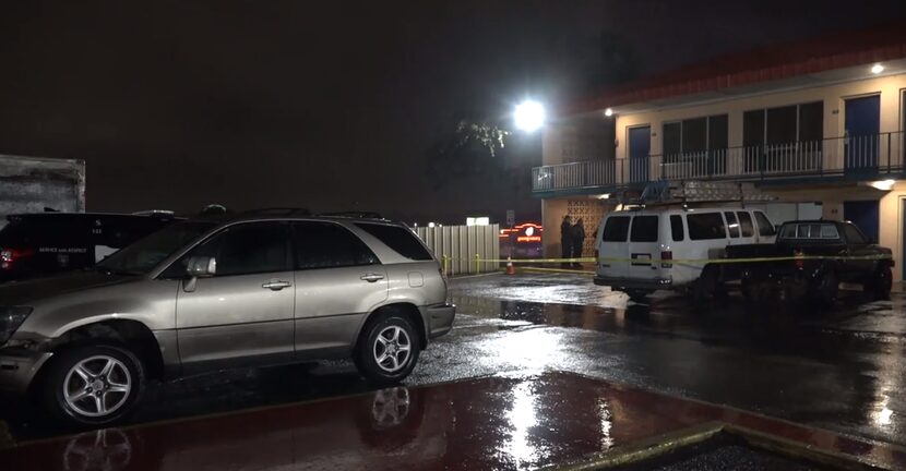 Officers stand outside the Days Inn motel at 4213 South Freeway in Fort Worth after being...