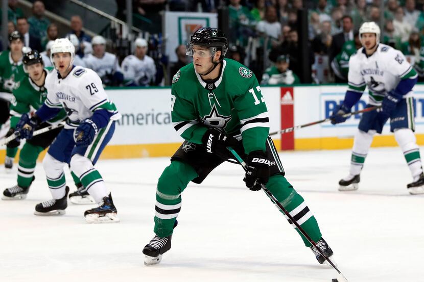 Dallas Stars center Mattias Janmark (13) lines up a shot at the net during the first period...